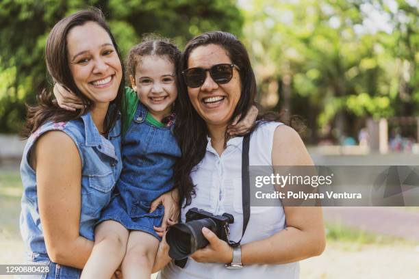 portrait of family in the public park - aunyy stock pictures, royalty-free photos & images