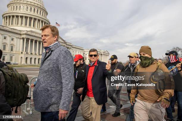 Former General Michael Flynn, President Donald Trump’s recently pardoned national security adviser, departs a protest of the outcome of the 2020...