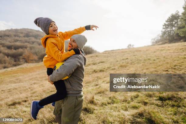 cheering for my son! - cold temperature lifestyle stock pictures, royalty-free photos & images