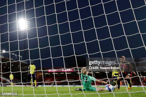 Junior Stanislas of AFC Bournemouth scores their team's fourth goal past Ryan Schofield of Huddersfield Town during the Sky Bet Championship match...