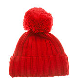 Red knit winter bobble hat isolated on white