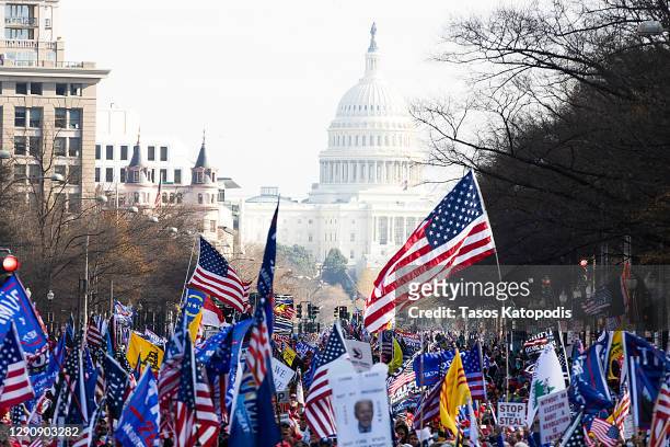 People gather in support of President Donald Trump and in protest the outcome of the 2020 presidential election at freedom plaza on December 12, 2020...