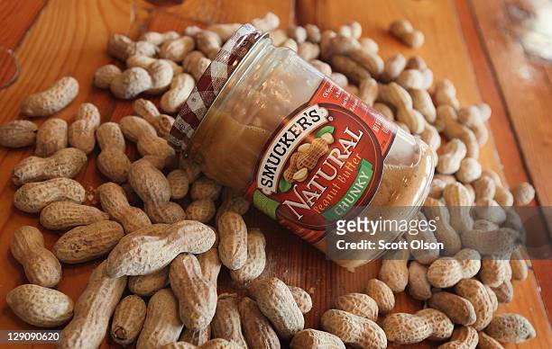 In this photo illustration, A jar of Smucker's Natural peanut butter is pictured on October 12, 2011 in Chicago, Illinois. This summer's hot, dry...