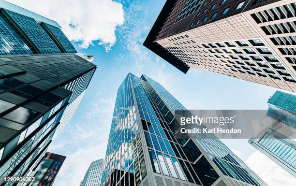 a view looking up at frankfurt city buildings - stock photo - grattacielo foto e immagini stock