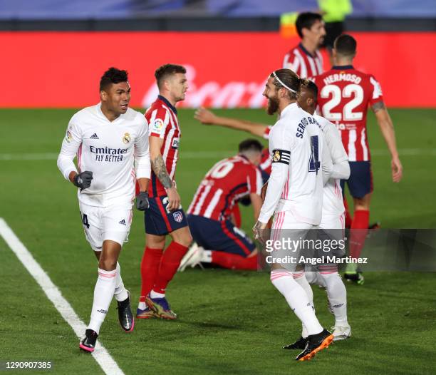 Casemiro of Real Madrid celebrates with teammates Sergio Ramos and Vinicius Junior after scoring their sides first goal during the La Liga Santander...