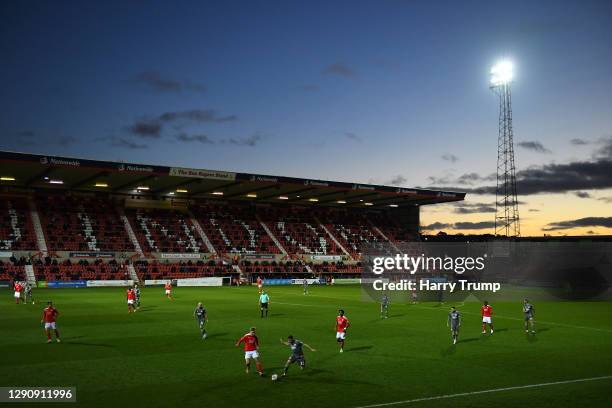 Matthew Smith of Swindon Town looks to break past Sam Finley of Fleetwood Town during the Sky Bet League One match between Swindon Town and Fleetwood...