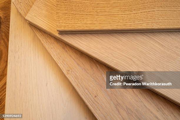 top view, selective focus of light engineered hardwood or laminate flooring samples. - wood laminate flooring stockfoto's en -beelden