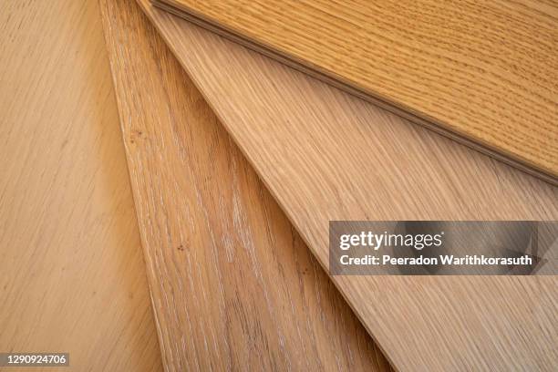 top view, selective focus of light engineered hardwood or laminate flooring samples. - engineered hardwood imagens e fotografias de stock