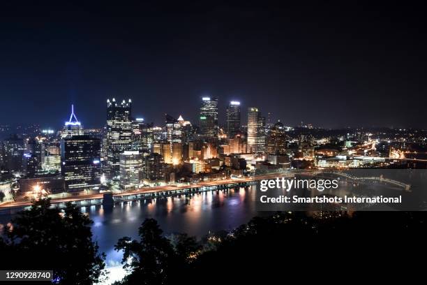 pittsburgh skyline illuminated at night from mount washington in pittsburgh, pennsylvania, usa - pittsburgh aerial stock pictures, royalty-free photos & images