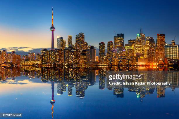 illuminated toronto skyline after sundown, canada - toronto skyline stock pictures, royalty-free photos & images