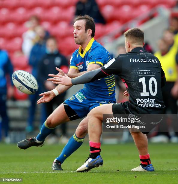 Morgan Parra of Clermont Auvergne passes the ball as Callum Sheedy challenges during the Heineken Champions Cup Pool 2 match between Bristol Bears...