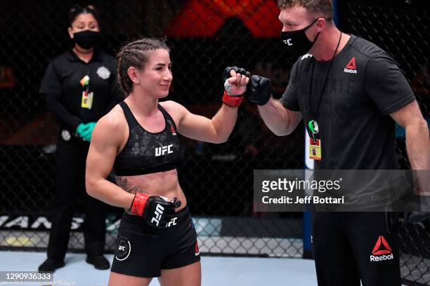 Tecia Torres celebrates her victory over Sam Hughes in their women's strawweight bout during the UFC 256 event at UFC APEX on December 12, 2020 in...