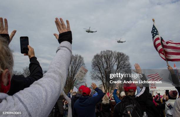 President Donald Trump flies in Marine-1 over a pro-Trump rally of supporters demonstrating against the election results, on December 12, 2020 in...