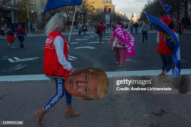 President Donald Trump supporters demonstrating against the election results march to the Supreme Court to protest against the Court's decision not...