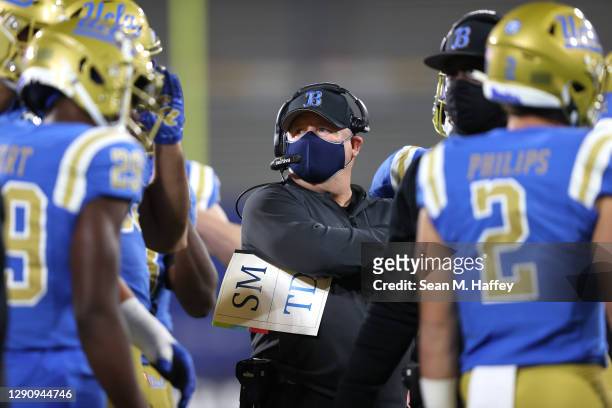 Head coach Chip Kelly of the UCLA Bruins looks on during the first half of a game against the USC Trojans at the Rose Bowl on December 12, 2020 in...