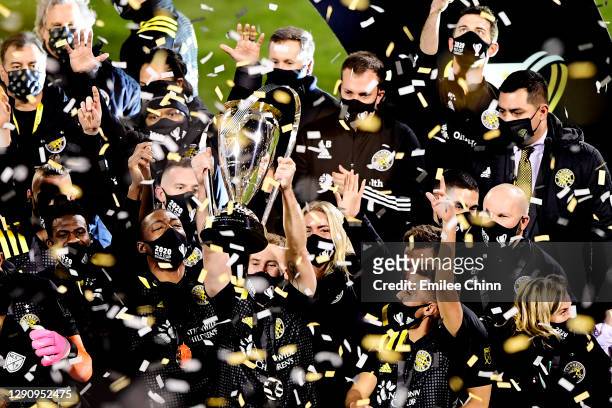 Josh Williams of Columbus Crew celebrates with the MLS Cup after a 3-0 win over the Seattle Sounders during the MLS Cup Final at MAPFRE Stadium on...