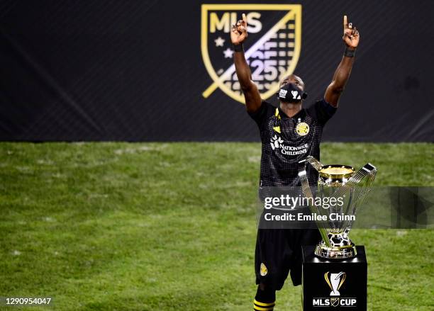 Jonathan Mensah of Columbus Crew celebrates with the MLS Cup after a 3-0 win over the Seattle Sounders during the MLS Cup Final at MAPFRE Stadium on...