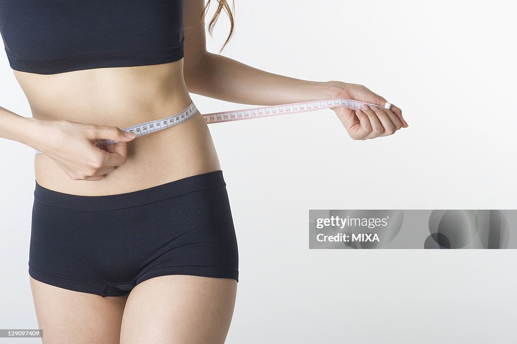 Woman Measuring Waist