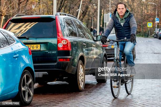 Prime Minister of the Netherlands Mark Rutte arrives on his bicycle at the Catshuis presidential home for further consultation on the coronavirus...