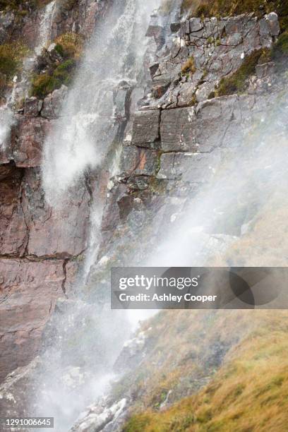 moorland stream waterfalls on the coast at stoer in assynt, scotland, uk, blowing uphill in storm force winds. - point of stoer fotografías e imágenes de stock