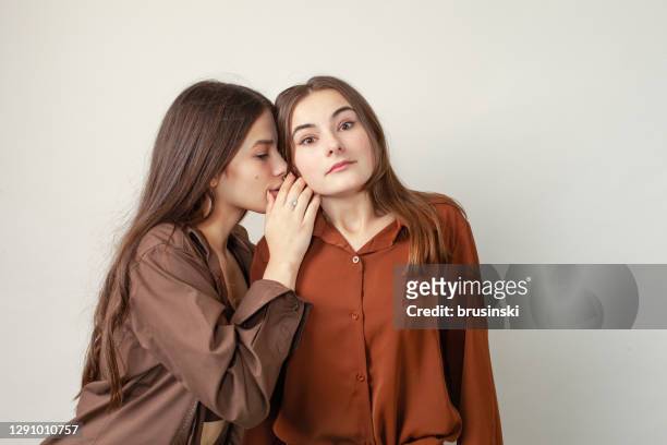 studio portrait of two 17 year old teen girls - 16 year stock pictures, royalty-free photos & images