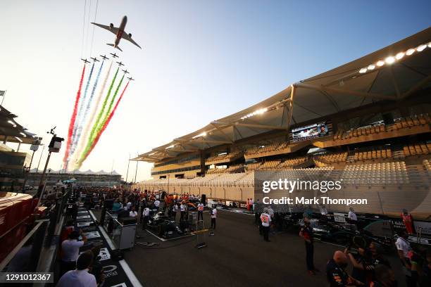 General view of the grid as an aerial display is seen over the circuit prior to the F1 Grand Prix of Abu Dhabi at Yas Marina Circuit on December 13,...