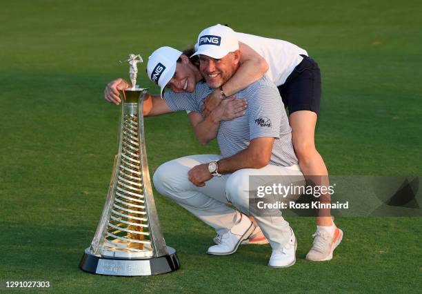 Lee Westwood of England and his girlfriend and caddie, Helen Storey pictured with the Race to Dubai trophy after the final round of the DP World Tour...