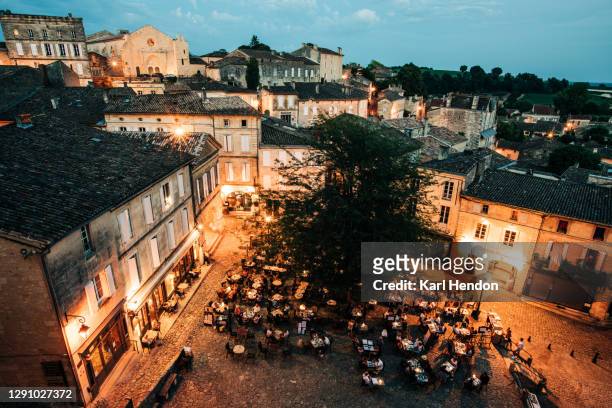 a view of the village of st.emilion in france at dusk - stock photo - bordeaux wine - fotografias e filmes do acervo