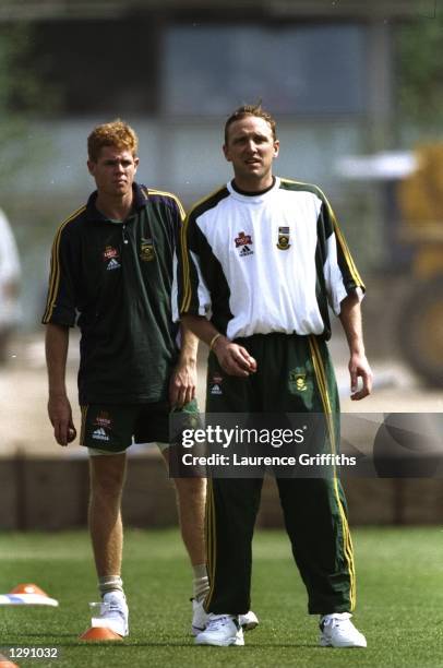 Shaun Pollock and Allan Donald of South Africa stand on the pitch during a training session at Lord's in London. \ Mandatory Credit: Laurence...