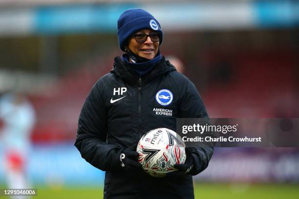 Brighton manager Hope Powell keeps an eye on the warm up during the Barclays FA Women's Super League match between Brighton & Hove Albion Women and...