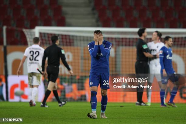 Bastian Oczipka of Schalke reacts after the Bundesliga match between FC Augsburg and FC Schalke 04 at WWK-Arena on December 13, 2020 in Augsburg,...