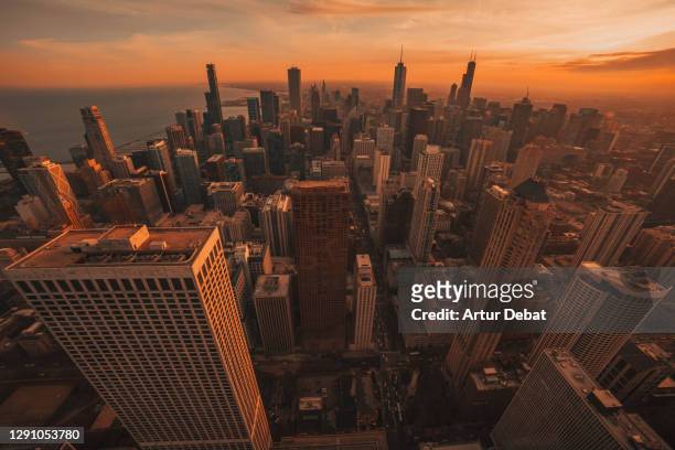 the chicago skyline during sunset with willis tower and lake michigan. - chicago neighborhood stock-fotos und bilder