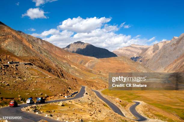 mountain road through mountains, leh, ladakh, india - national landmark stock pictures, royalty-free photos & images