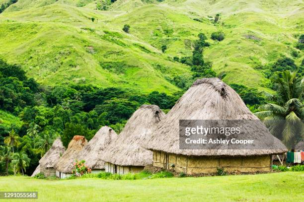 navala village in the fijian highlands the only village left on the island still composed entirely of traditional bure houses. - fiji hut stock pictures, royalty-free photos & images