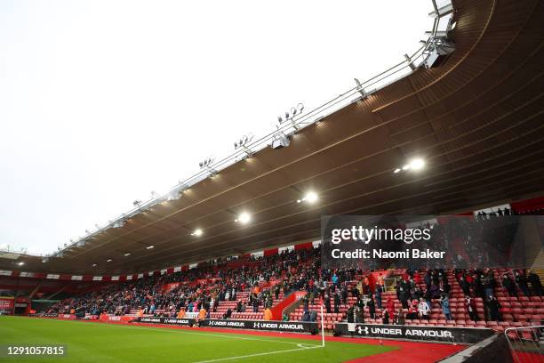 General view inside the stadium as fans take their seats inside the stadium socially distanced and wearing face masks during the Premier League match...