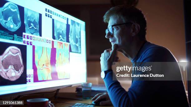 orthopaedic research mature man - radiologist stock pictures, royalty-free photos & images