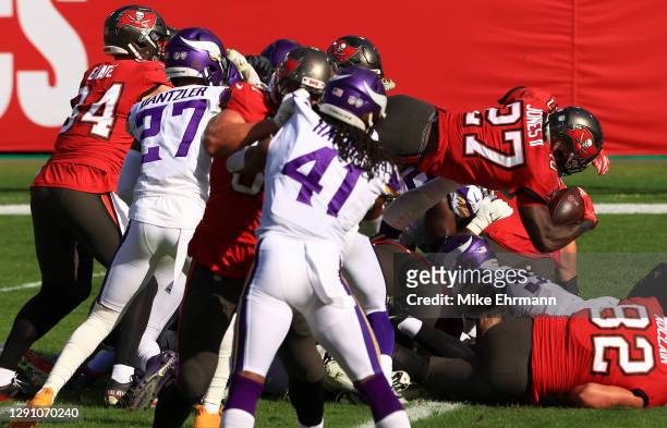 Ronald Jones of the Tampa Bay Buccaneers dives in for a touchdown in the second quarter against the Minnesota Vikings at Raymond James Stadium on...