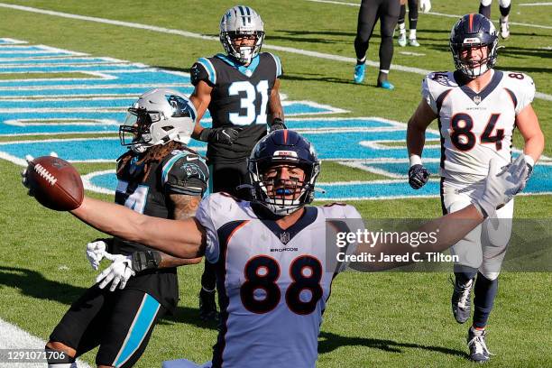 Nick Vannett of the Denver Broncos celebrates his two-yard touchdown reception against the Carolina Panthers during the second quarter at Bank of...
