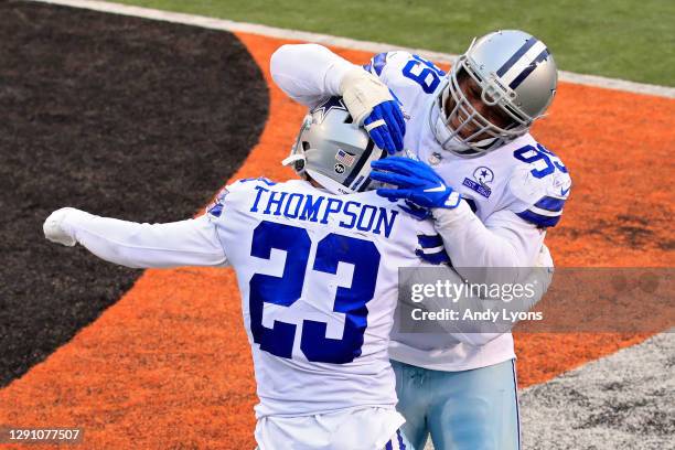 Darian Thompson and Antwaun Woods of the Dallas Cowboys react in the fourth quarter against the Cincinnati Bengals at Paul Brown Stadium on December...