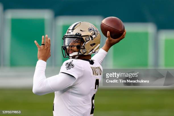 Quarterback Jameis Winston of the New Orleans Saints warms up before the start of the Saints and Philadelphia Eagles game at Lincoln Financial Field...