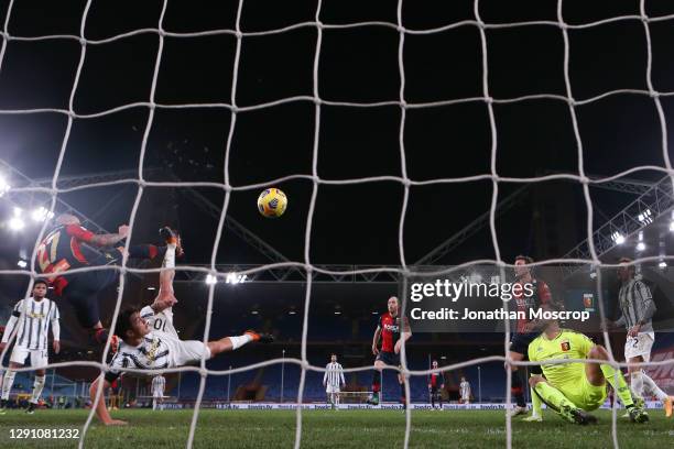 Mattia Perin of Genoa CFC looks on as Paulo Dybala of Juventus scores a spectacular overhead kick only for his effort to be disallowed by the referee...