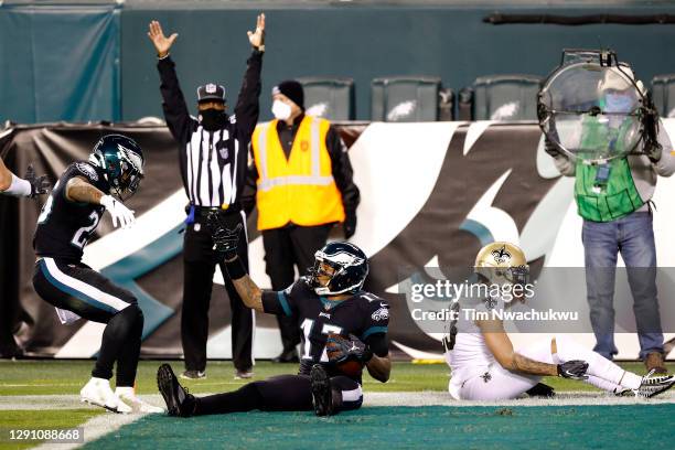 Wide receiver Alshon Jeffery of the Philadelphia Eagles celebrates after catching a touchdown pass in front of cornerback Marshon Lattimore of the...