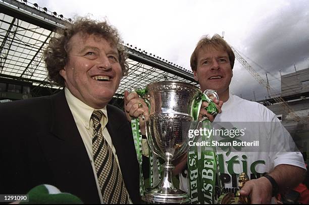 Celtic Coach Wim Jansen and Murdo McLeod celebrate after a Scottish Premier League match against St Johnstone at Celtic Park in Glasgow, Scotland....