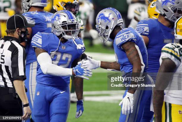 Andre Swift of the Detroit Lions celebrates scoring a second quarter rushing touchdown against the Green Bay Packers at Ford Field on December 13,...