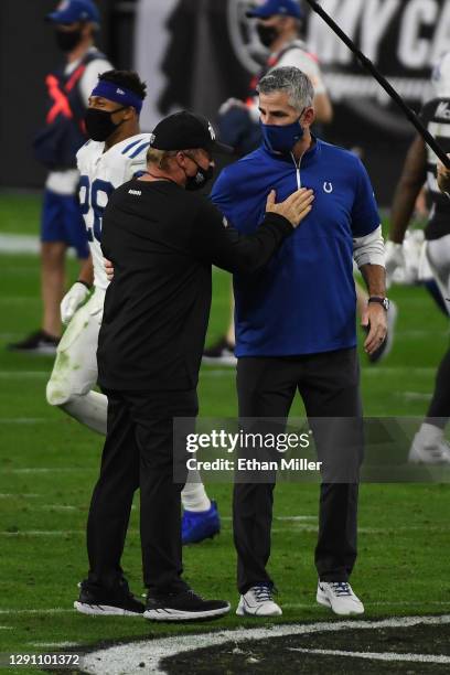 Head coach Jon Gruden of the Las Vegas Raiders greets head coach Frank Reich of the Indianapolis Colts after the Colts' 44-27 victory over the...