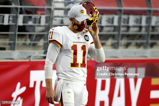 Quarterback Alex Smith of the Washington Football Team looks on from the sidelines during the game against the San Francisco 49ers at State Farm...