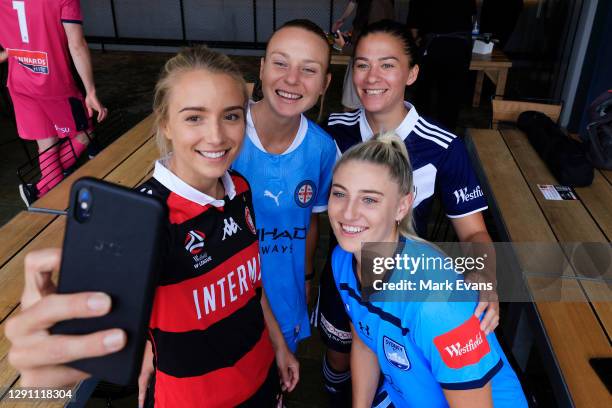 Georgia Yeoman Dale of Western Sydney Wanderers, takes a selfie with Teigen Allen of Melbourne City, Angie Beard of Melbourne Victory, and Remy...