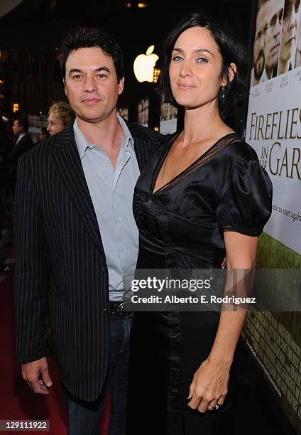 Actress Carrie-Anne Moss and Steven Roy arrive at the "Fireflies In The Garden" Premiere at Pacific Theaters at the Grove on October 12, 2011 in Los...