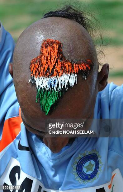 Indian cricket fan Sudhir Kumar Gautham poses with his haircut in the...  News Photo - Getty Images