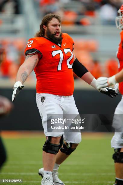 Left guard Josh Sills of the Oklahoma State Cowboys greets his team after a touchdown and point after against the Texas Tech Red Raiders at Boone...